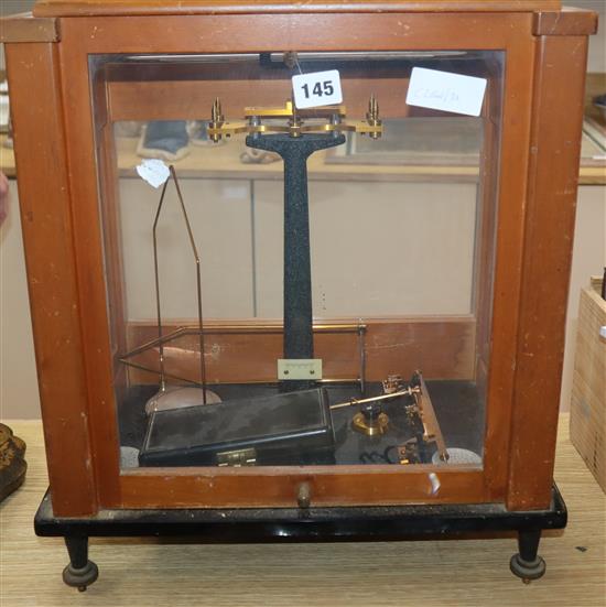A Stanton Instruments lab balance, in cabinet with weights, brass